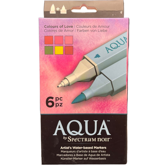 Packaging of Aqua by Spectrum Noir water-based markers with a pink watercolor design on a white background.