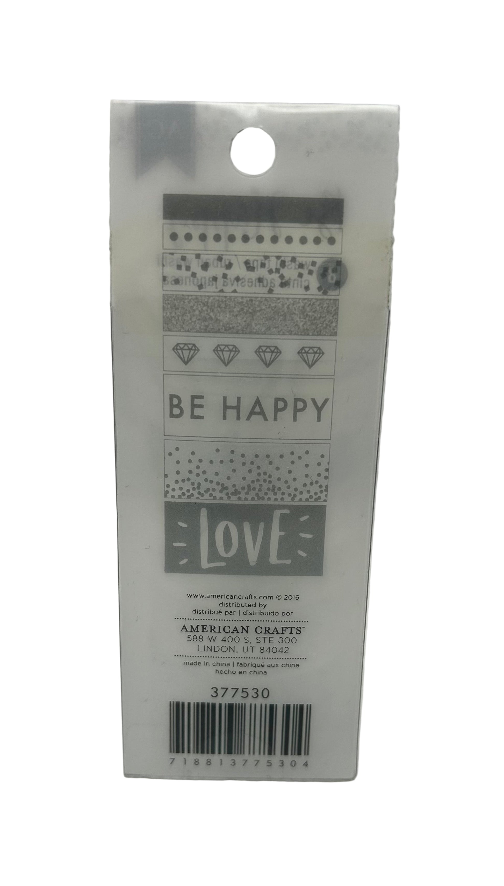Packaging with 'Be Happy' and 'Love' text on a white background
