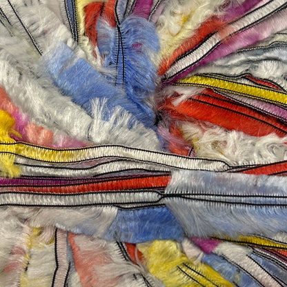 Colorful striped fabric wreath on a white background