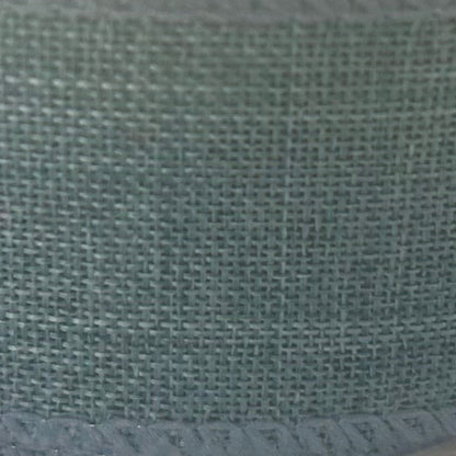 Close-up of a textured green fabric surface