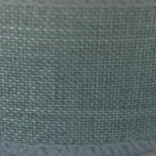 Close-up of a textured green fabric surface