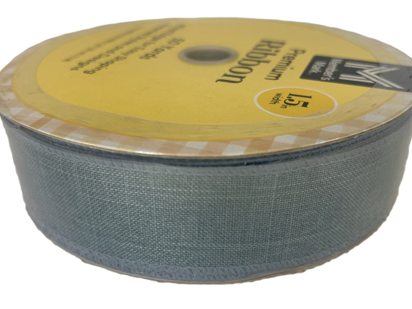 Roll of Kevlar fabric with a yellow label on a white background