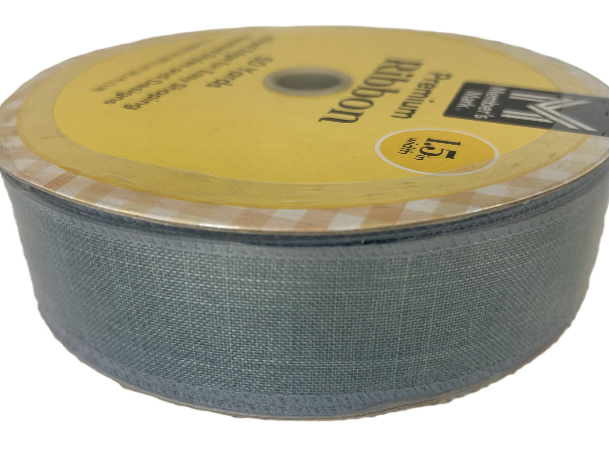 Roll of Kevlar fabric with a yellow label on a white background