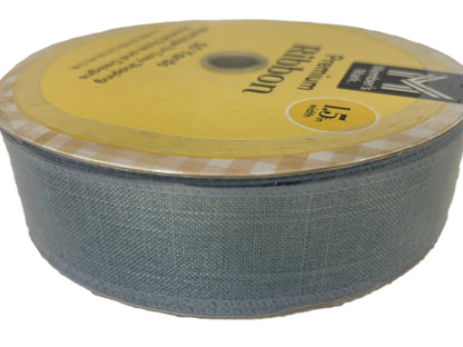 Roll of Kevlar fabric with a yellow label on a white background
