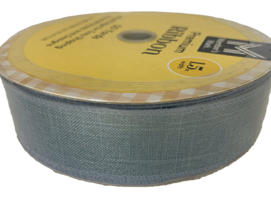 Roll of Kevlar fabric with a yellow label on a white background