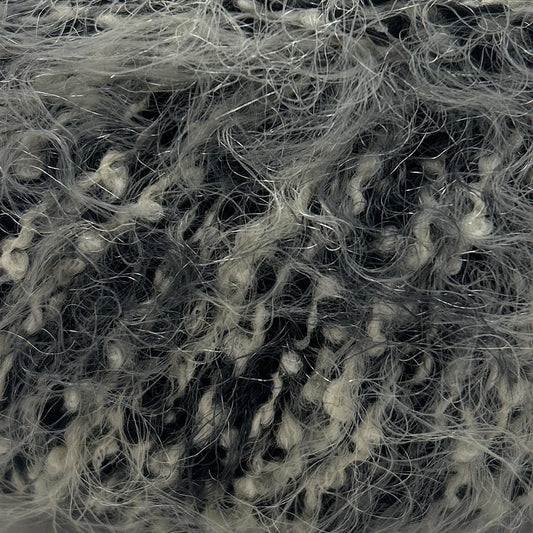 Ball of gray yarn with a label on a white background