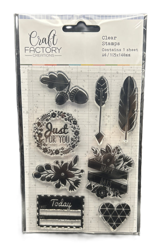 Packaged clear stamps with various designs including feathers, flowers, and text on a white background.