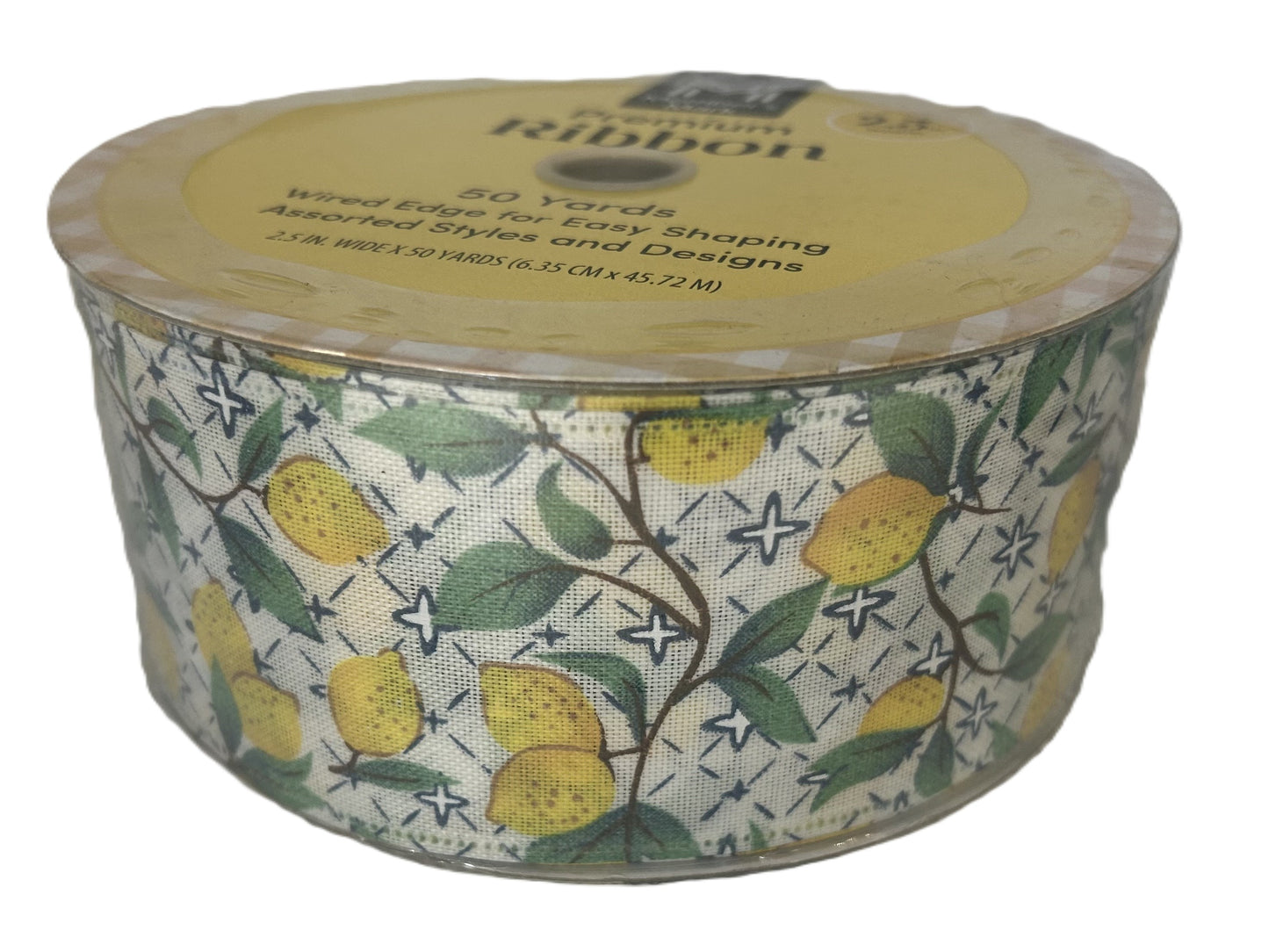 Spool of ribbon with lemon design on a white background
