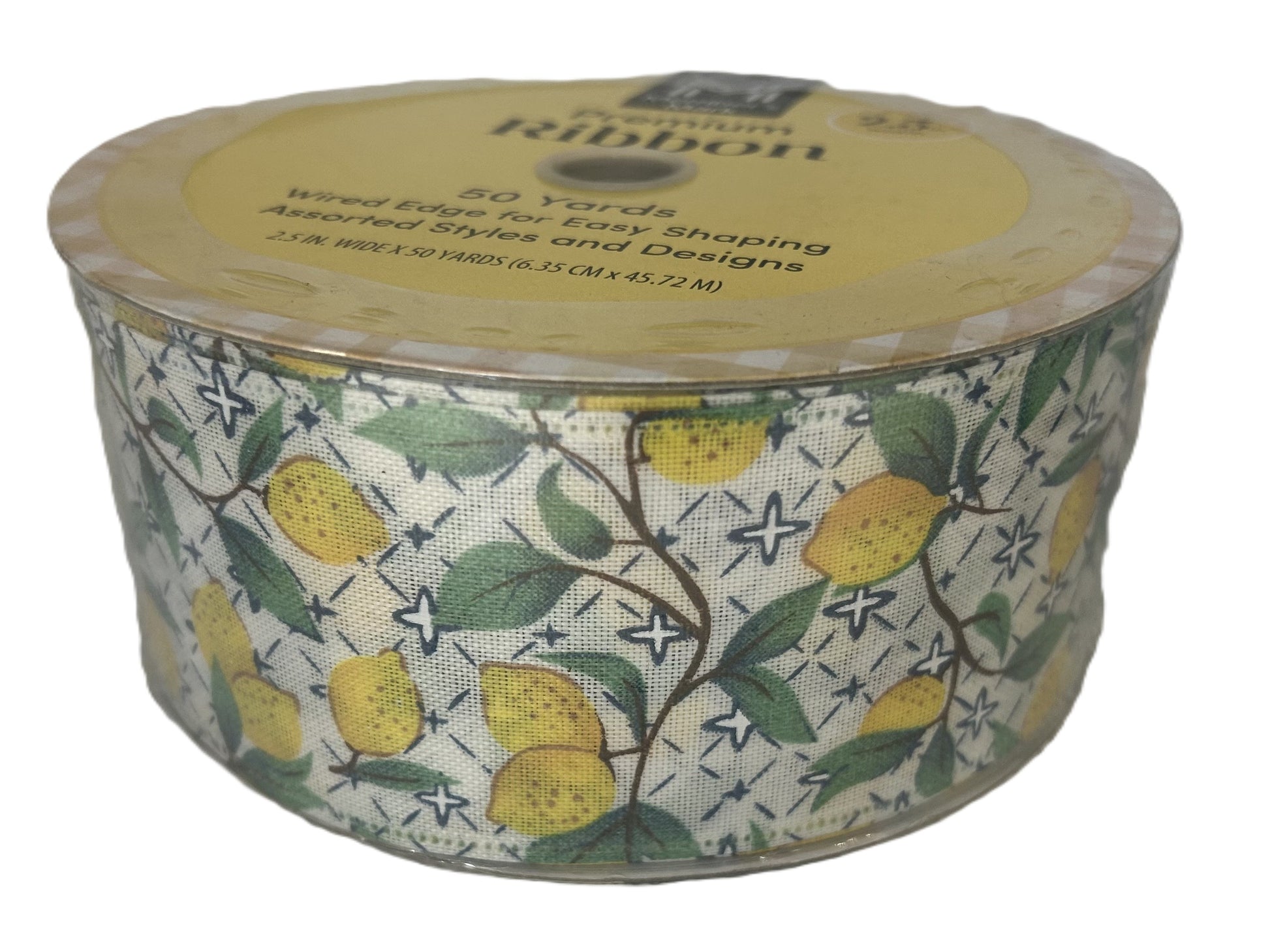 Spool of ribbon with lemon design on a white background