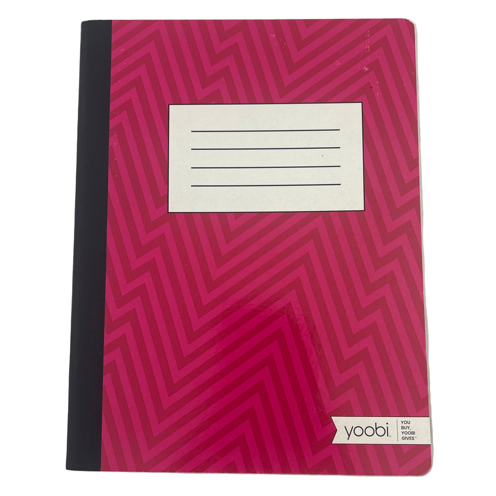 Pink notebook with black geometric pattern on a white background