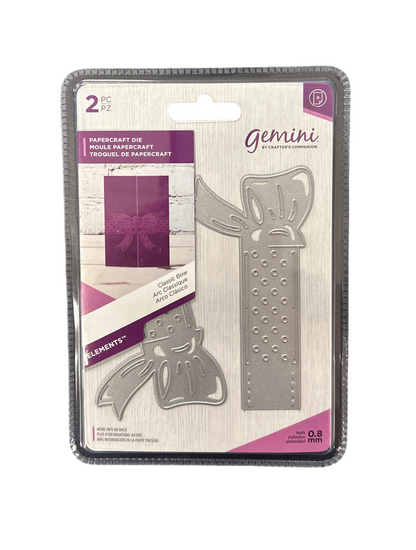 Metallic paper crafting dies with decorative elements on a Gemini packaging.