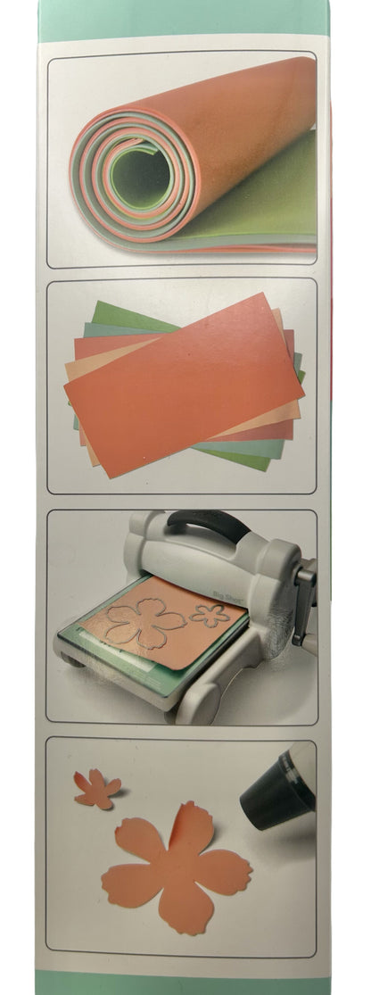 Set of craft materials including paper, a printer, and decorative items on a white background.