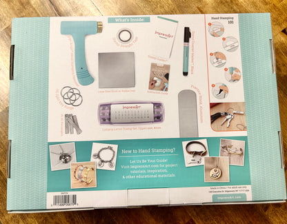Jewelry-making kit packaging with tools and materials on a wooden surface