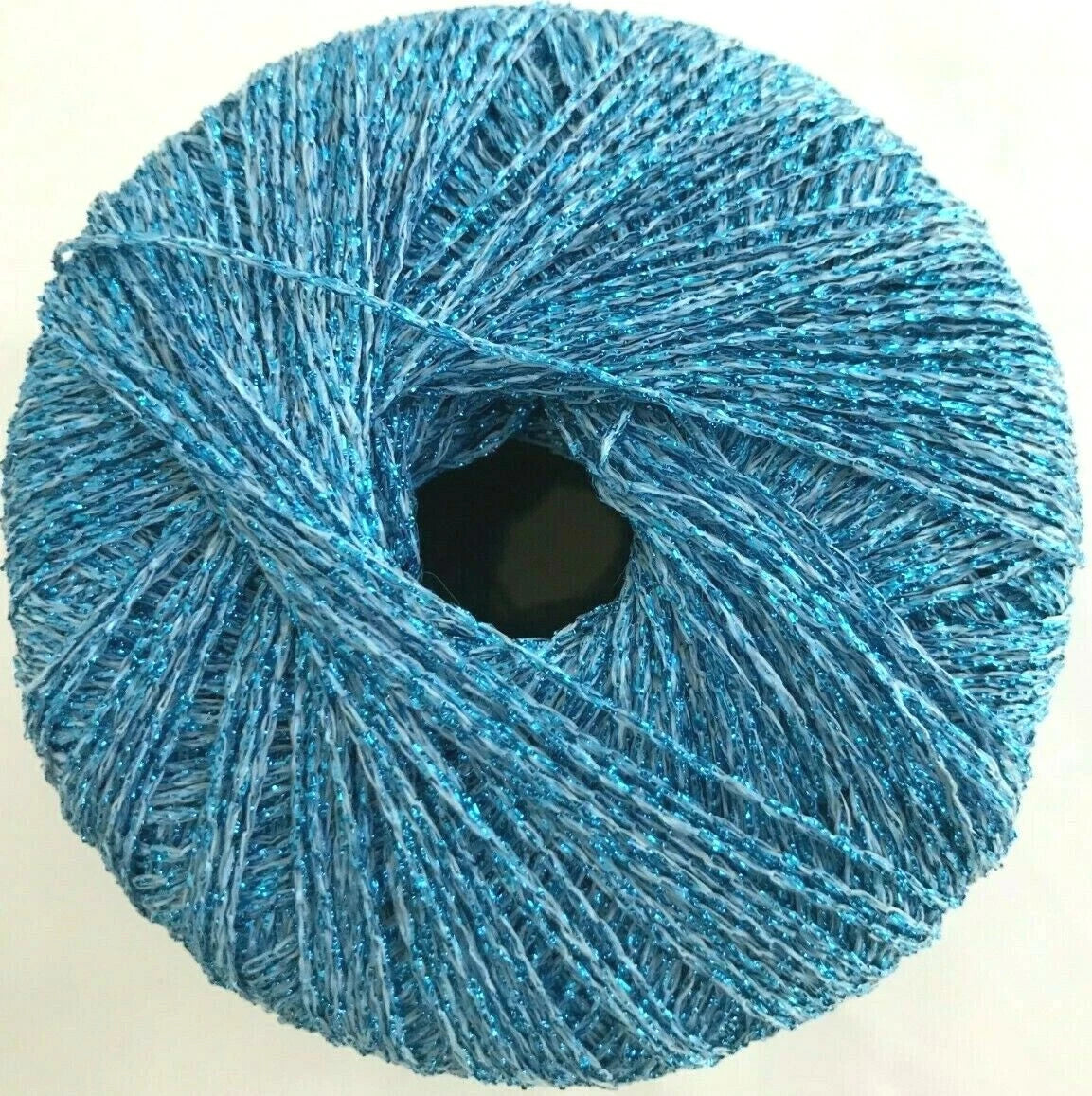 Blue yarn ball on a beige background