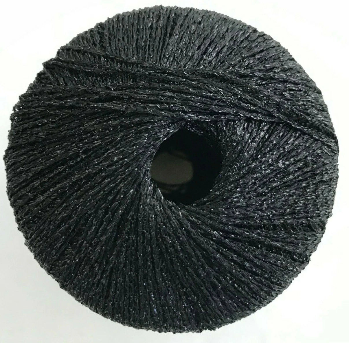 Ball of dark gray yarn on a white background