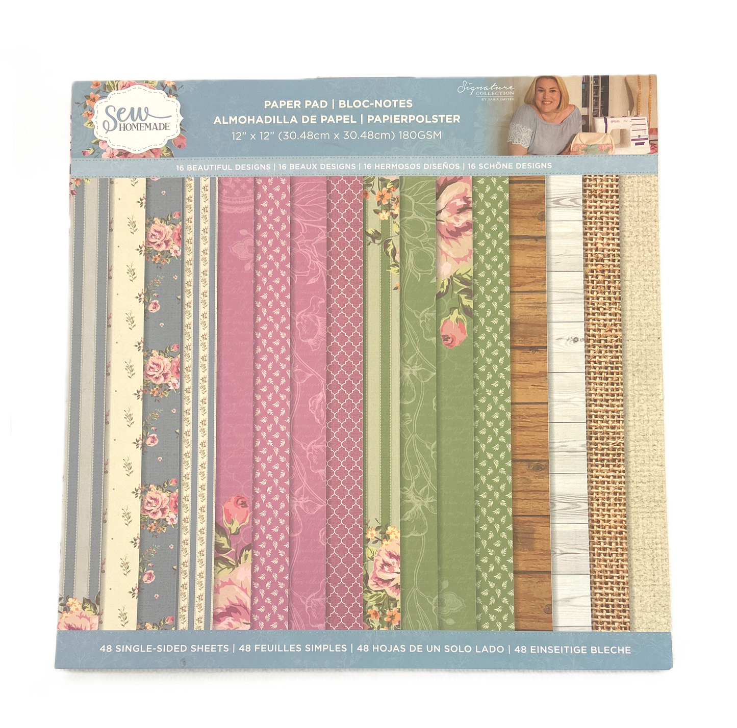 Pack of patterned paper sheets with a decorative cover featuring a woman and text.