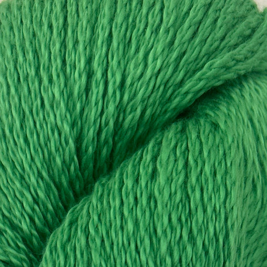 Green skein of yarn with a blue label on a light gray background