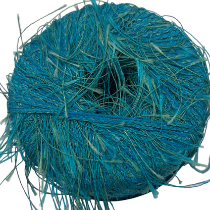 Blue thread spool on a white background