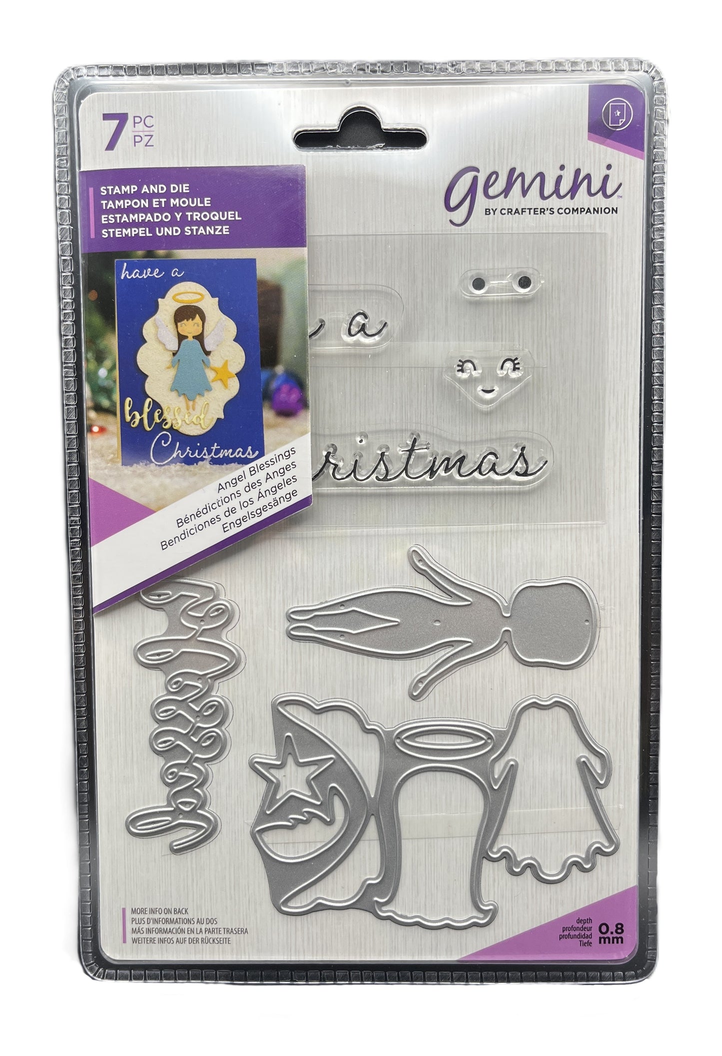 Packaged Gemini stamp and die set with Christmas-themed designs on a white background