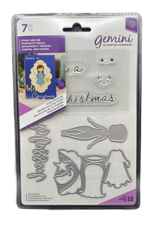 Packaged Gemini stamp and die set with Christmas-themed designs on a white background