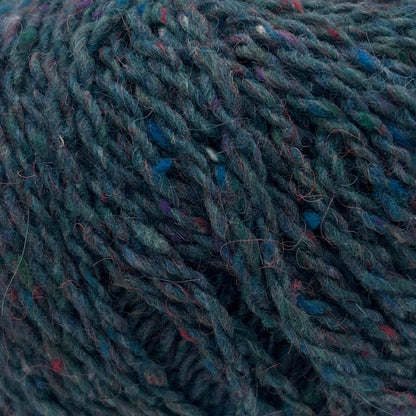 Blue skein of yarn with a label on a white background