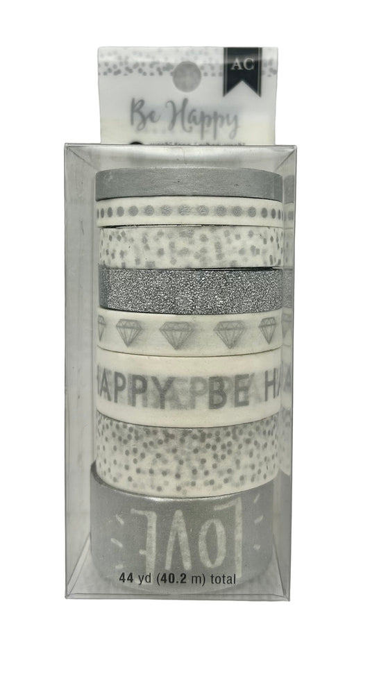 Set of washi tape rolls with decorative designs and text in a clear packaging on a white background.