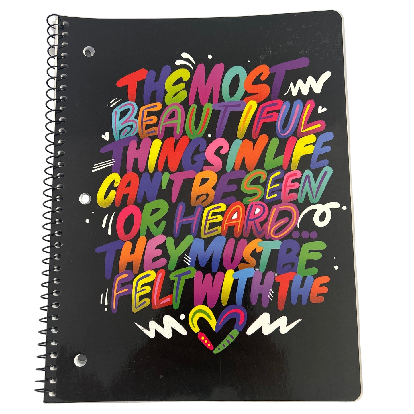 Black notebook with colorful text design on a white background