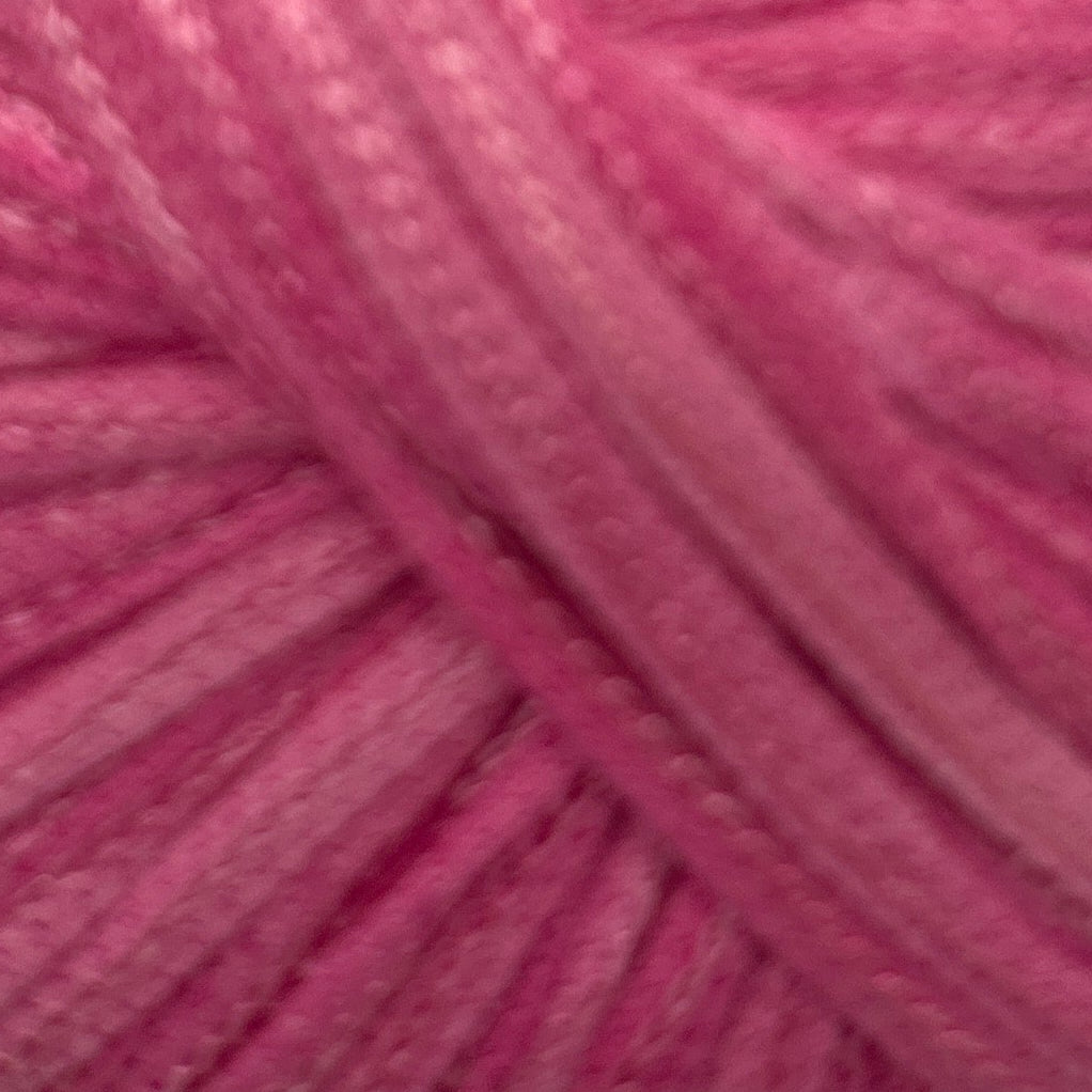 Close-up of pink yarn with a textured surface