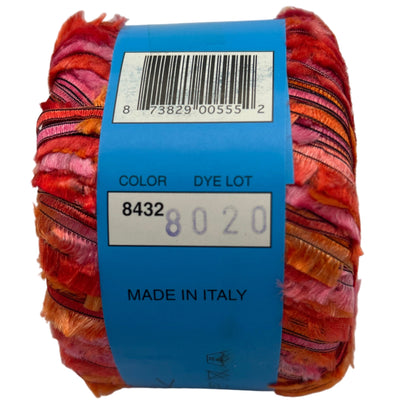 Multicolored yarn skein with a blue label displaying text and a barcode on a white background.