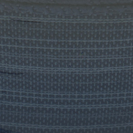 Close-up of a textured blue fabric with a subtle pattern