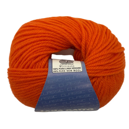 Orange ball of yarn with a label on a white background
