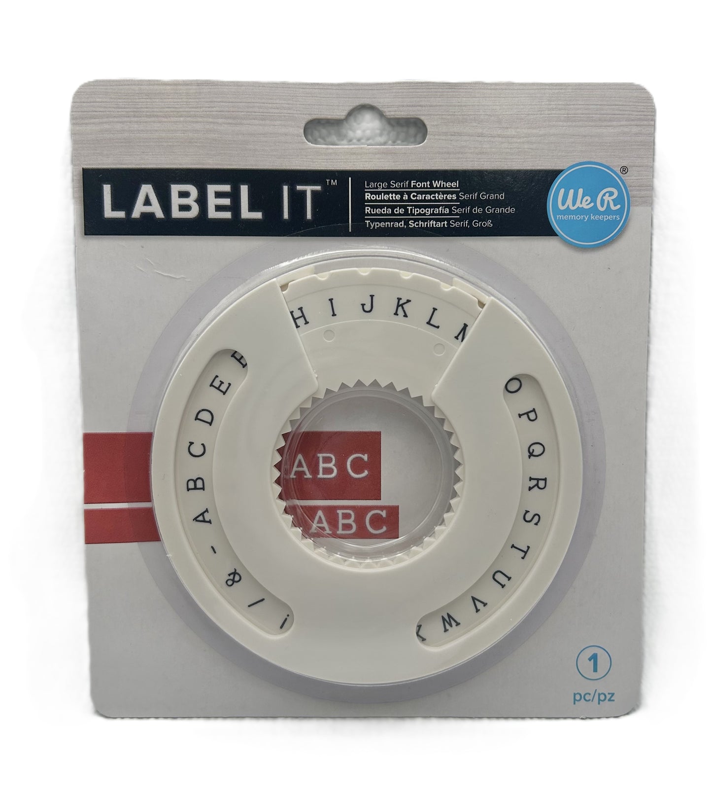 Labeling wheel with letter and number stamps in packaging on a white background