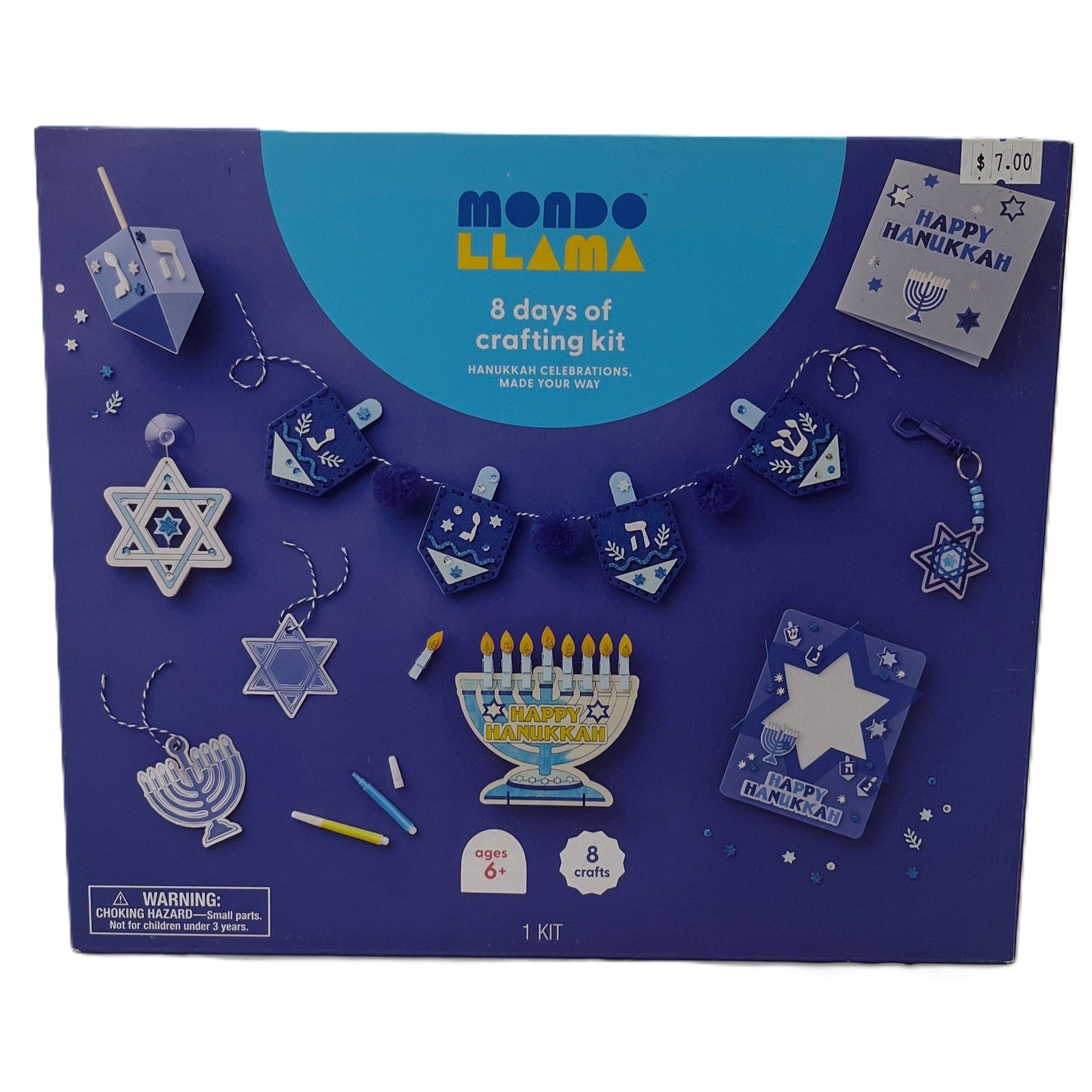 Mondo Llama Hanukkah crafting kit packaging with various craft items on a blue background