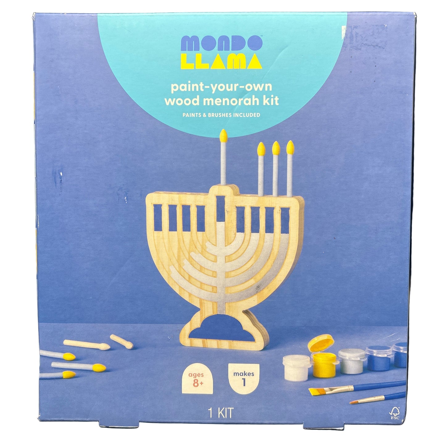 Paint-your-own wood Menorah kit packaging with blue background and Menorah illustration.