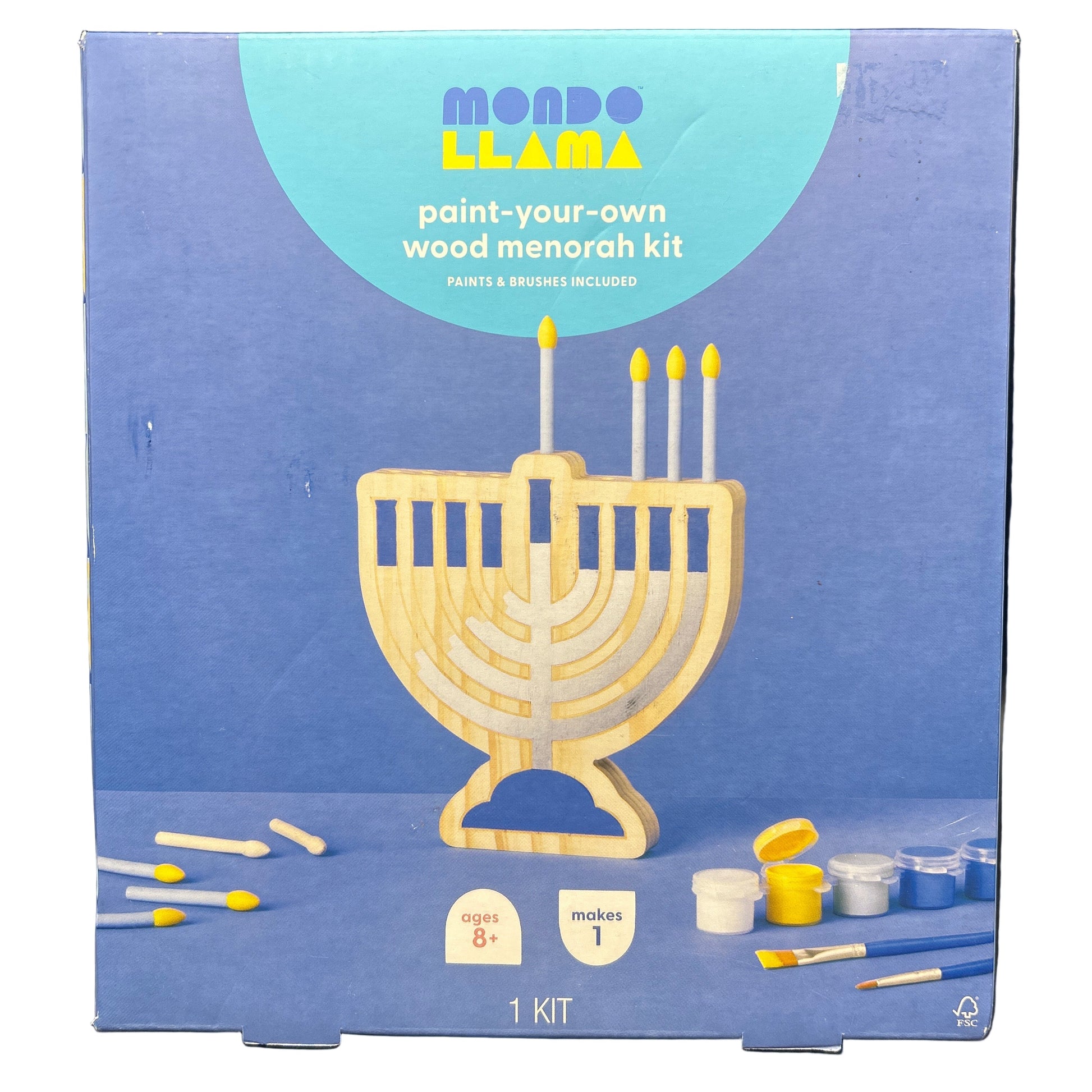 Paint-your-own wood Menorah kit packaging with blue background and Menorah illustration.