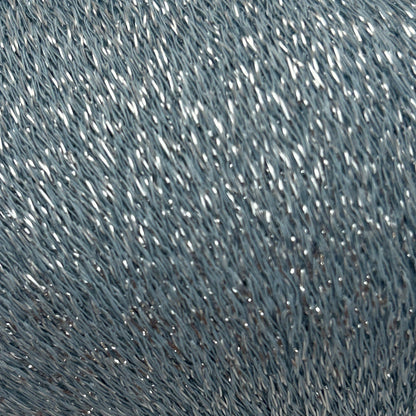 Close-up of textured blue fabric with a subtle pattern