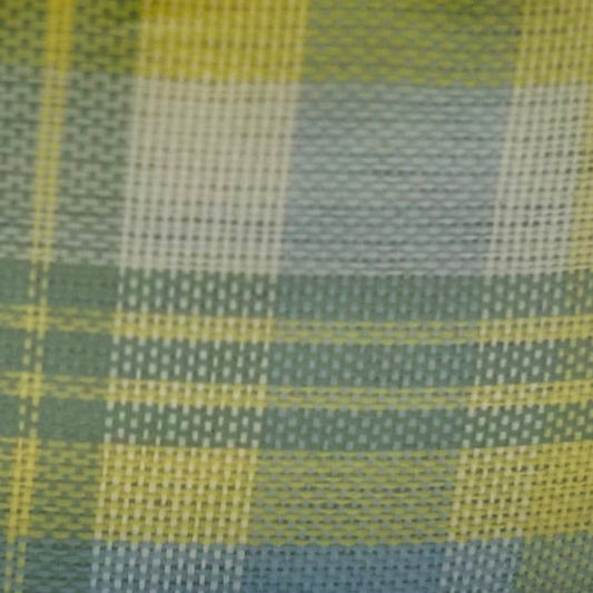 Roll of yellow and green plaid ribbon on a white background