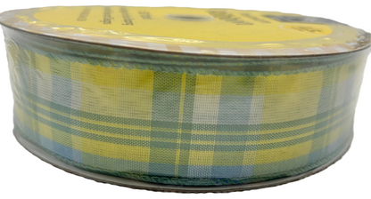 Roll of yellow and green plaid ribbon on a white background