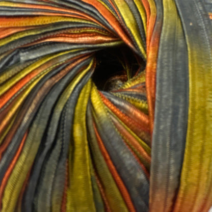 Colorful striped fabric roll on a white background