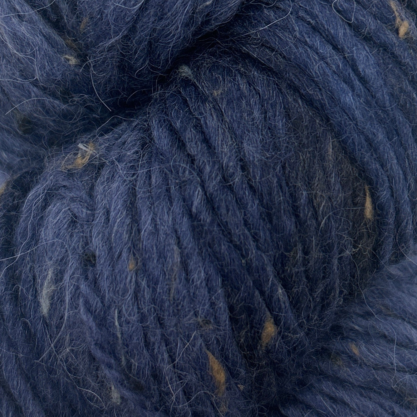 Close-up of dark blue yarn with visible fibers
