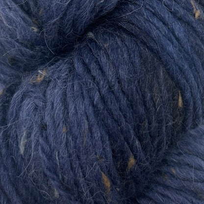 Close-up of dark blue yarn with visible fibers