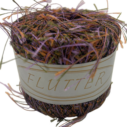 Decorative nest with colorful feathers and a 'Flutter' label on a white background