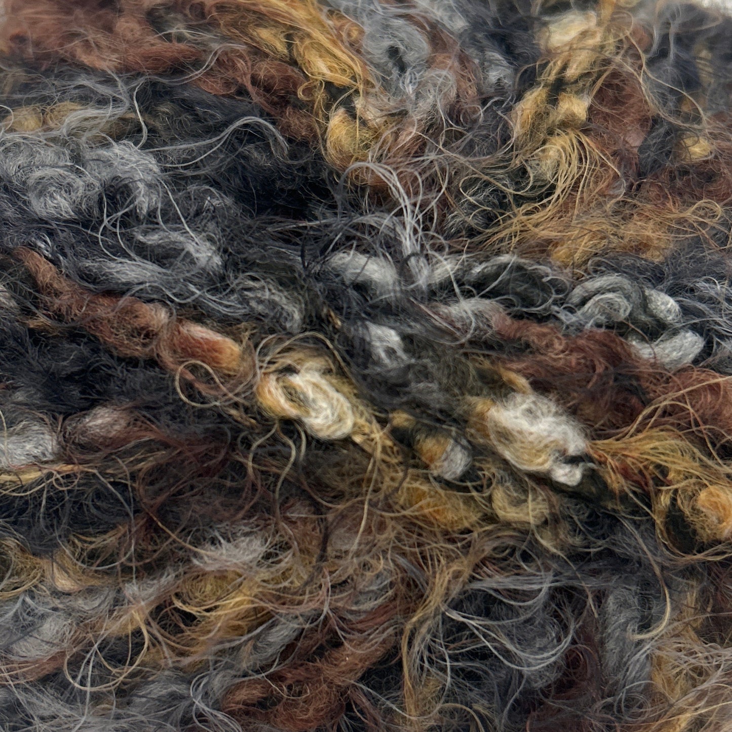 Ball of multicolored yarn on a white background
