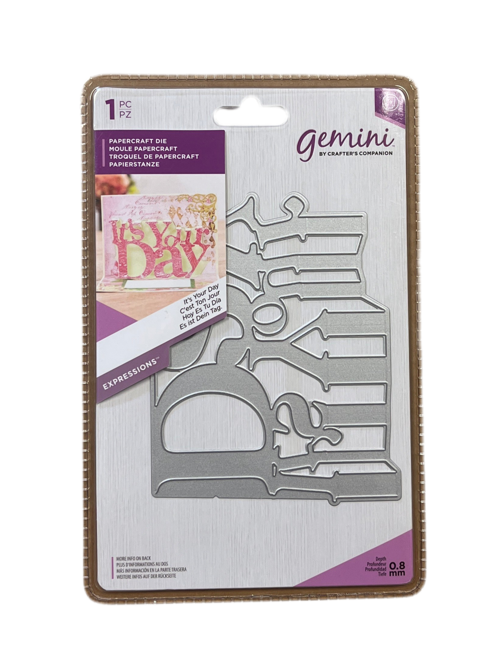 Packaging of Gemini paper craft die with cut-out shapes on a white background