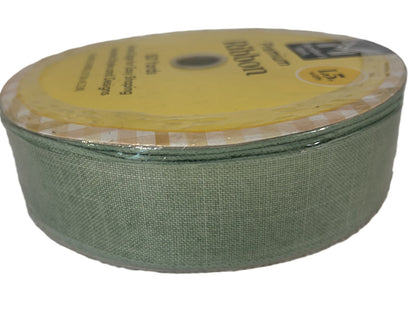 Green ribbon on a spool with a yellow label