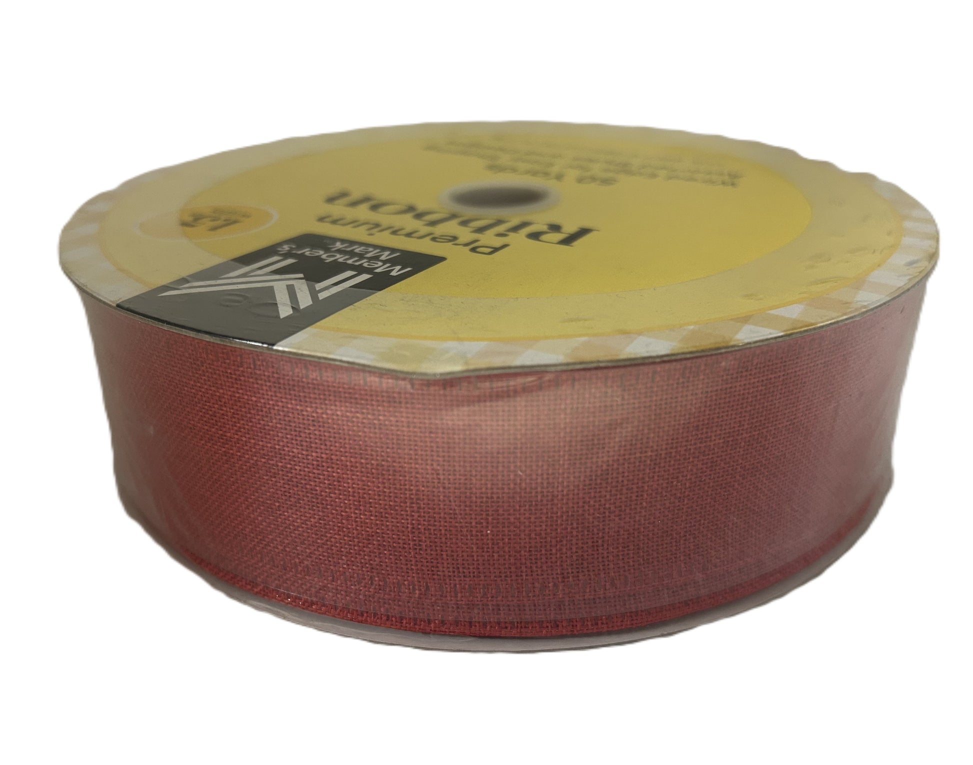 Spool of red ribbon with a yellow label on a white background