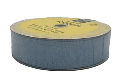 Spool of blue ribbon with a yellow label on a white background