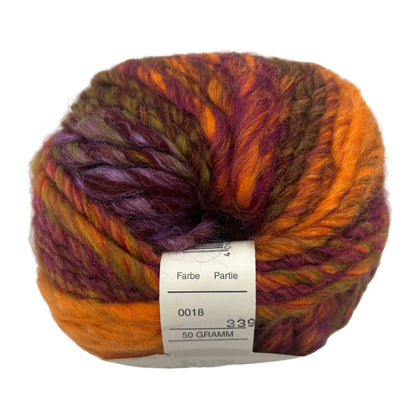 Multicolored yarn ball with a label on a white background