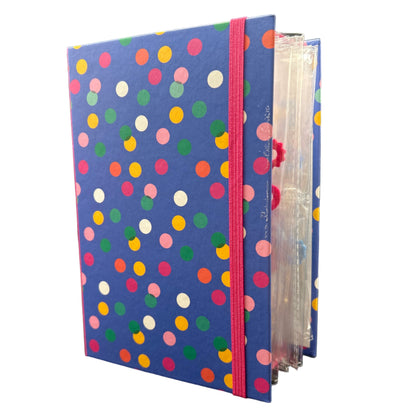 Polka dot file folder on a black surface