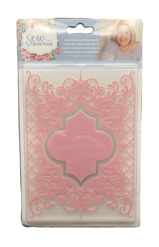 Decorative laser cut paper in packaging with a pink design on a white background